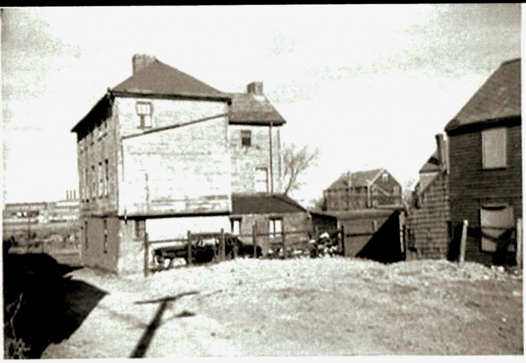 view of jefferson house showing driveway and fence location